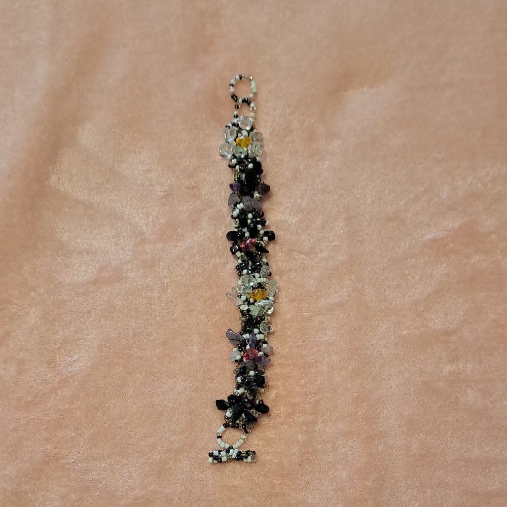 Elegant Beaded Bracelet with Black and Purple Accents